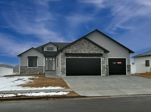 918 Jack Lane exterior with stone accents and three-car garage in Rigby, Idaho