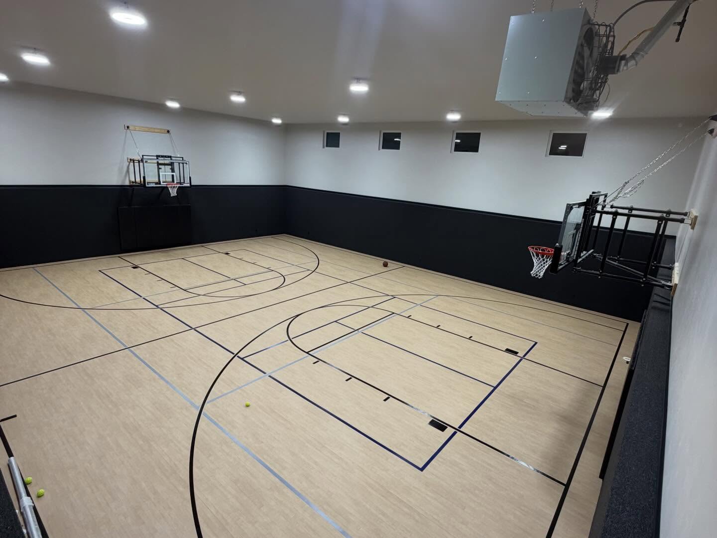 Indoor basketball court in a Jones Construction custom home