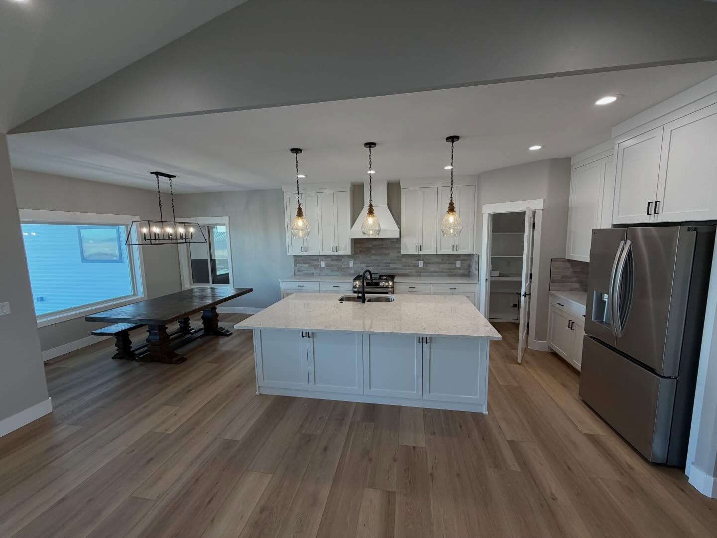 Open kitchen and dining space in a Jones spec home