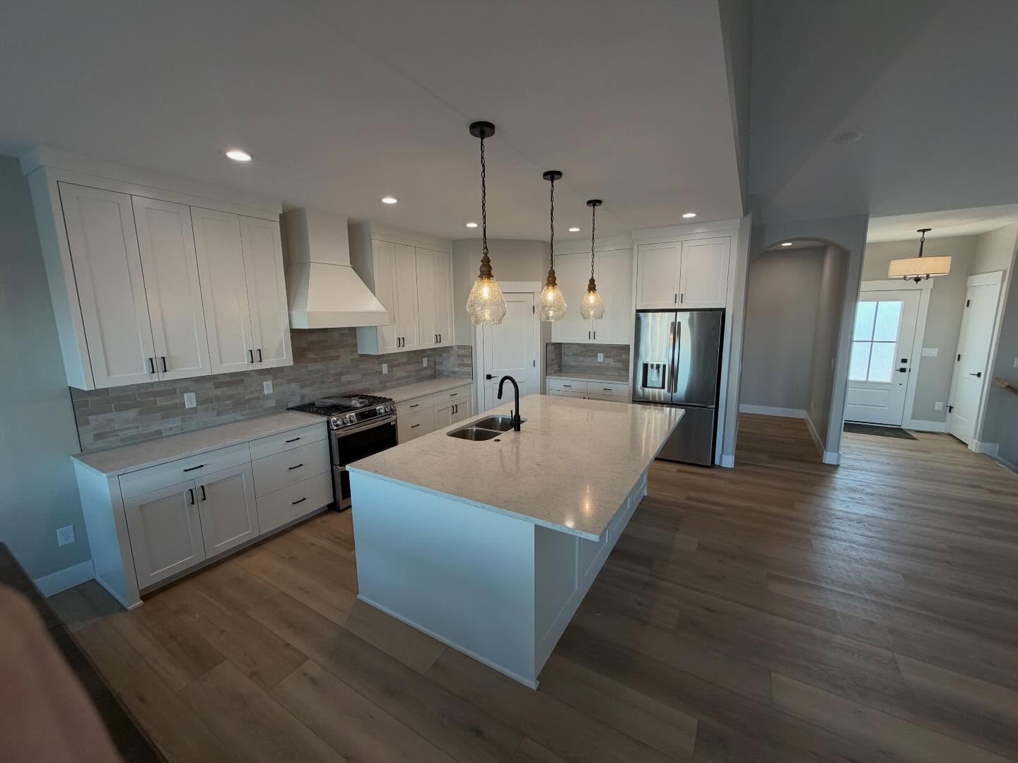 Modern white kitchen with quartz island